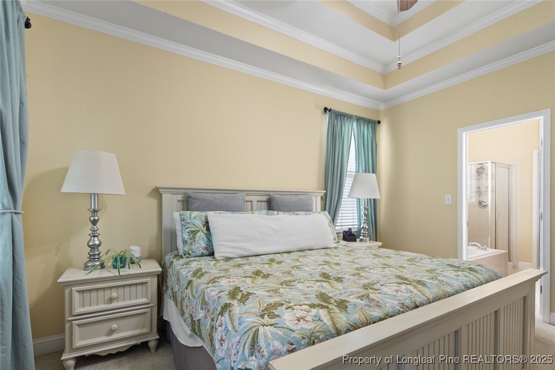 15 London Way Spring Lake, NC 28390 - Photo 26 of 46 a bedroom with a bed and a lamp