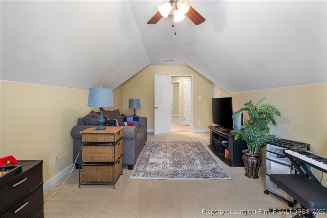 15 London Way Spring Lake, NC 28390 - Photo 34 of 46 a living room with furniture and a potted plant