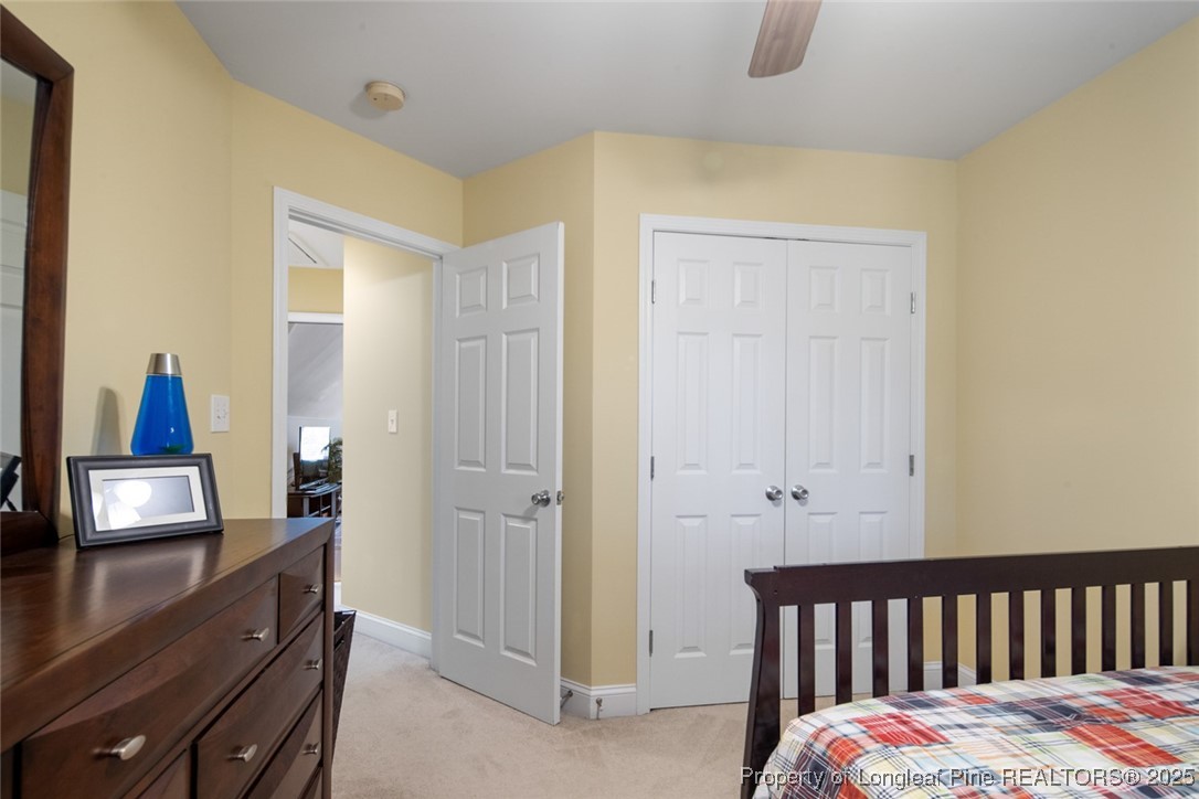 15 London Way Spring Lake, NC 28390 - Photo 37 of 46 a bedroom with a bed and wooden floor