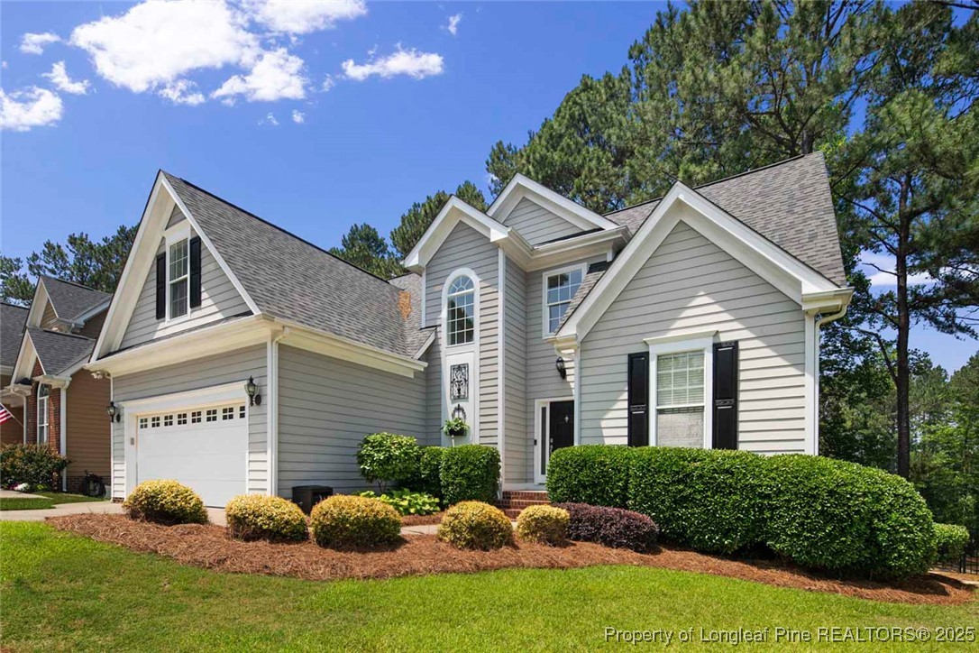 15 London Way Spring Lake, NC 28390 - Photo 4 of 46 a front view of a house with garden