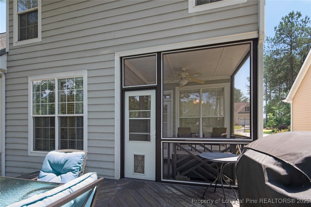 15 London Way Spring Lake, NC 28390 - Photo 41 of 46 a view of a patio with table and chairs and wooden fence