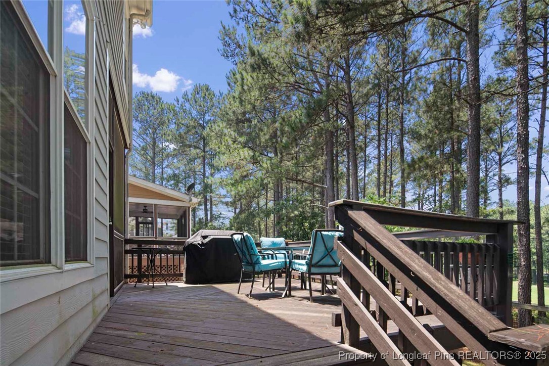 15 London Way Spring Lake, NC 28390 - Photo 42 of 46 a view of a chairs and tables in the balcony
