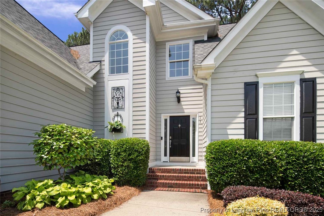 15 London Way Spring Lake, NC 28390 - Photo 7 of 46 a front view of a house with a garden