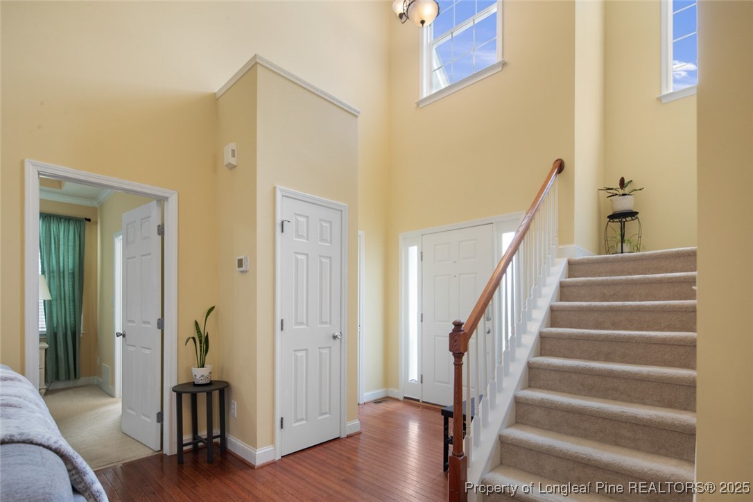15 London Way Spring Lake, NC 28390 - Photo 9 of 46 a view of a hallway with wooden floor and staircase