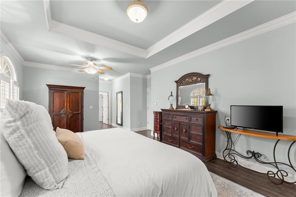 2195 East Maddox Road Buford, GA 30519 - Photo 19 of 100 a bedroom with a bed and a flat screen tv