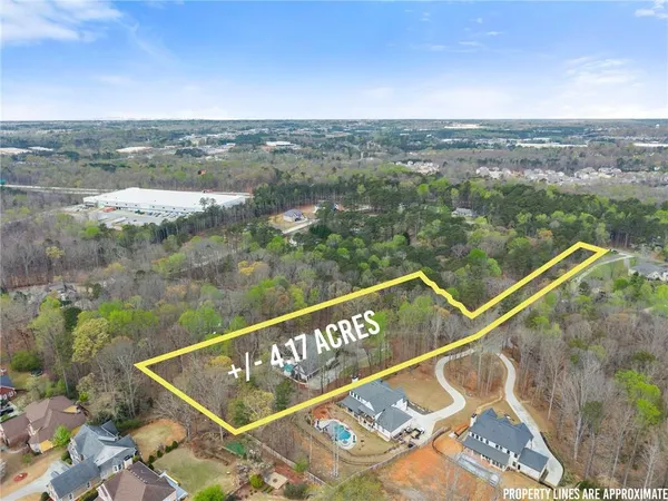 an aerial view of houses with yard