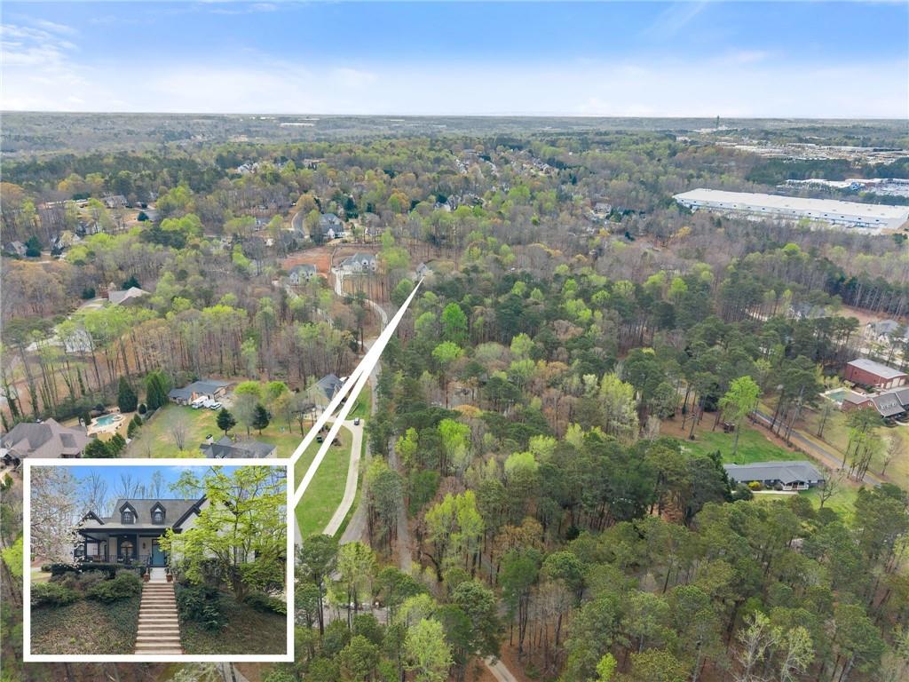 2195 East Maddox Road Buford, GA 30519 - Photo 3 of 100 an aerial view of houses with yard