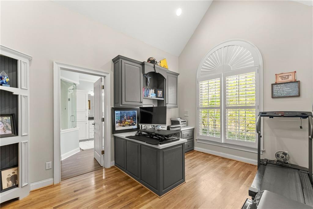 2195 East Maddox Road Buford, GA 30519 - Photo 31 of 100 a kitchen with stainless steel appliances a stove top oven a sink and a refrigerator