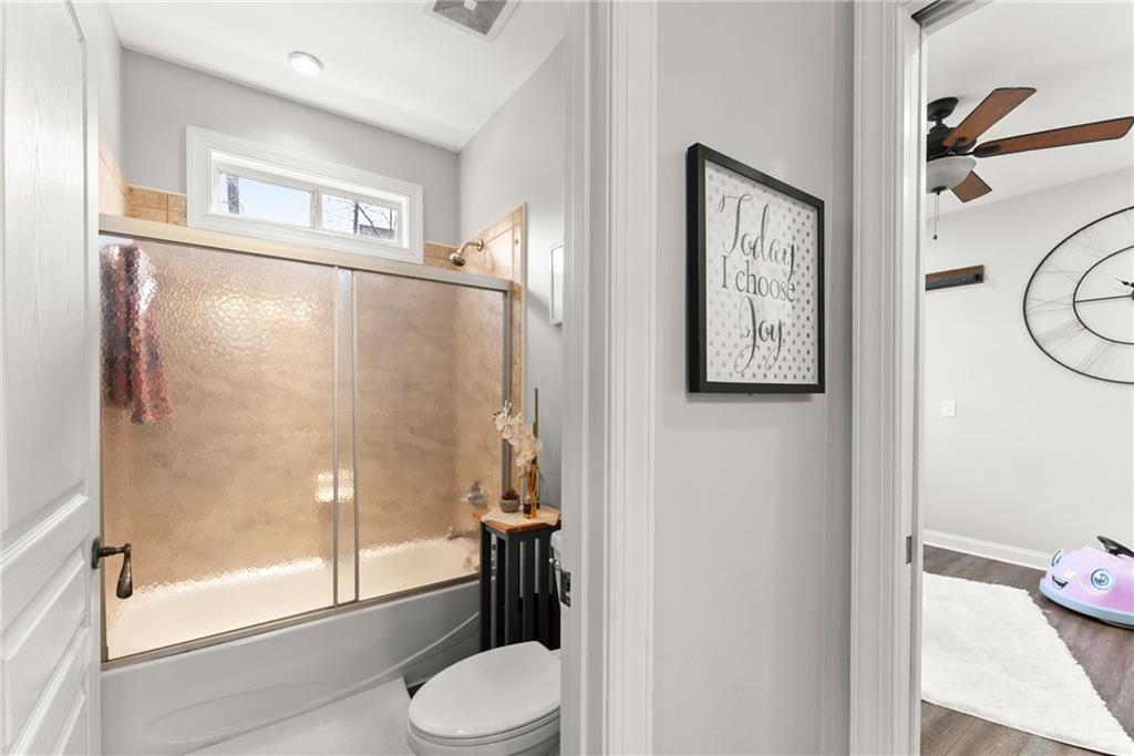 2195 East Maddox Road Buford, GA 30519 - Photo 35 of 100 a bathroom with a toilet and a shower
