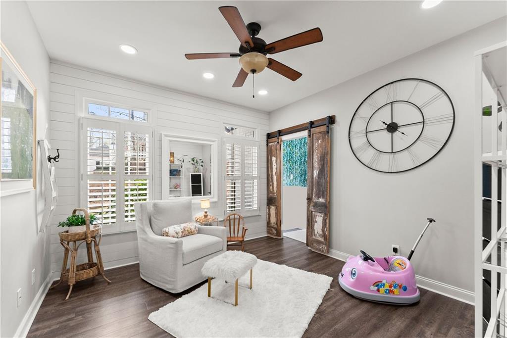 2195 East Maddox Road Buford, GA 30519 - Photo 36 of 100 a living room with furniture and wooden floor