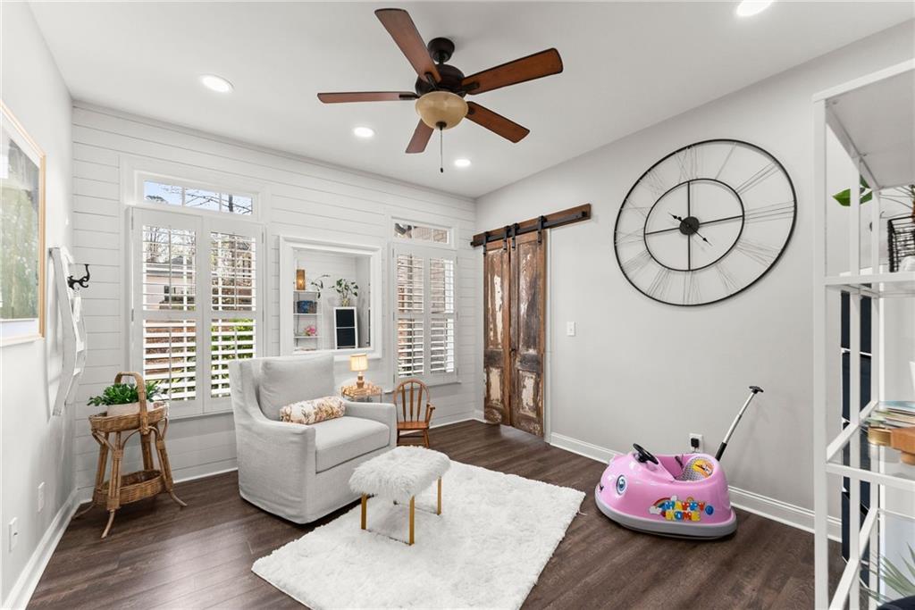 2195 East Maddox Road Buford, GA 30519 - Photo 40 of 100 a living room with furniture and wooden floor