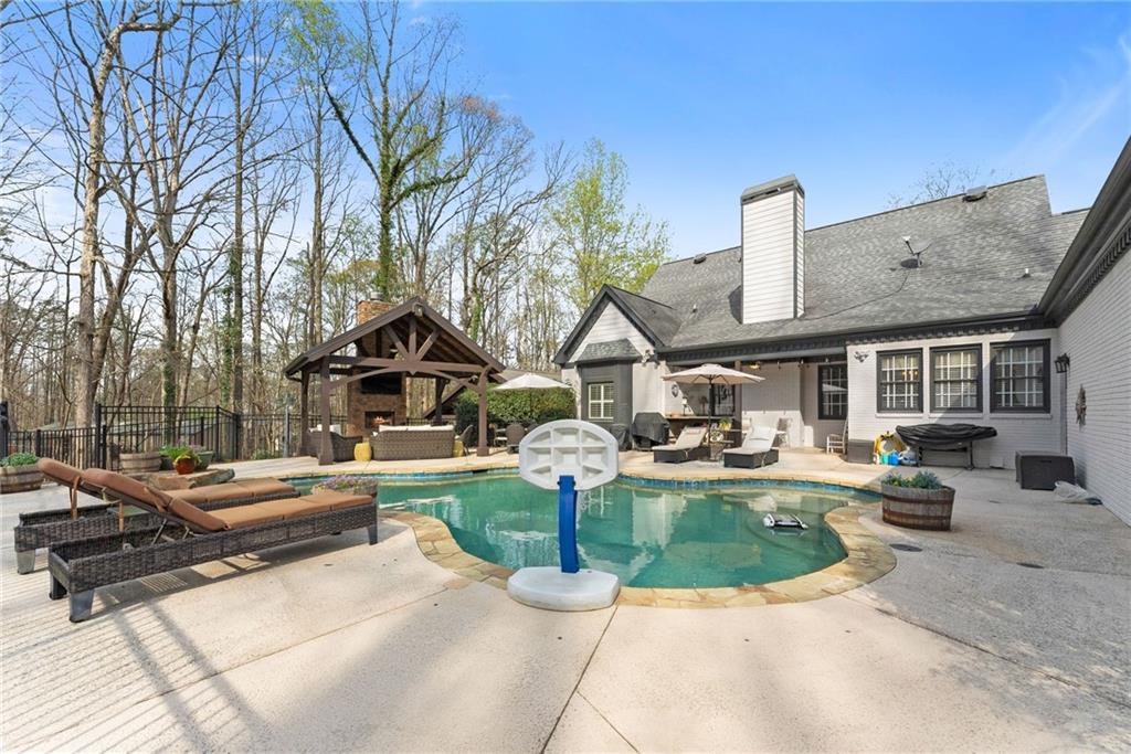 2195 East Maddox Road Buford, GA 30519 - Photo 4 of 100 a front view of a house with garden