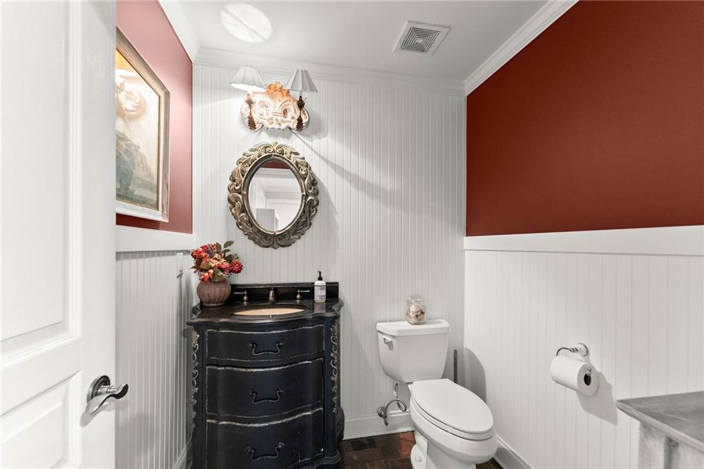 2195 East Maddox Road Buford, GA 30519 - Photo 48 of 100 a bathroom with a toilet a sink and a mirror