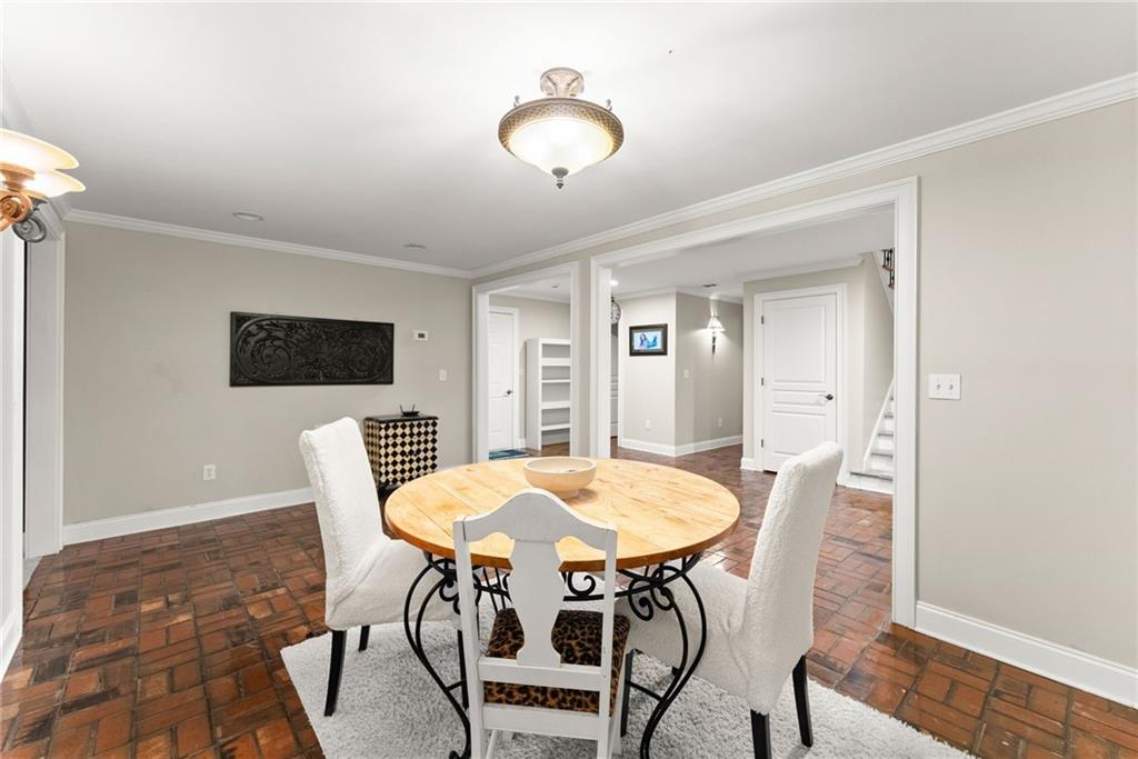 2195 East Maddox Road Buford, GA 30519 - Photo 50 of 100 a view of a dining room with furniture and wooden floor