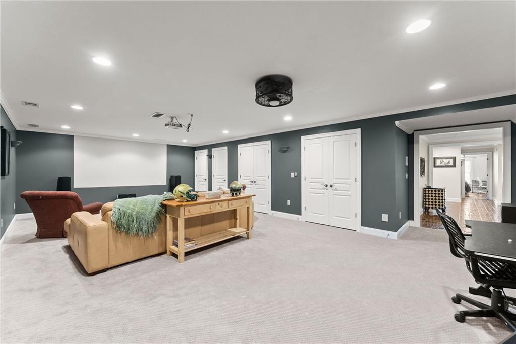 2195 East Maddox Road Buford, GA 30519 - Photo 53 of 100 a living room with furniture and a wooden floor
