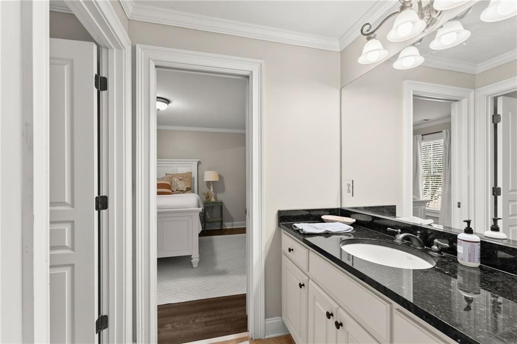 2195 East Maddox Road Buford, GA 30519 - Photo 56 of 100 a en suite bathroom with a sink and a mirror