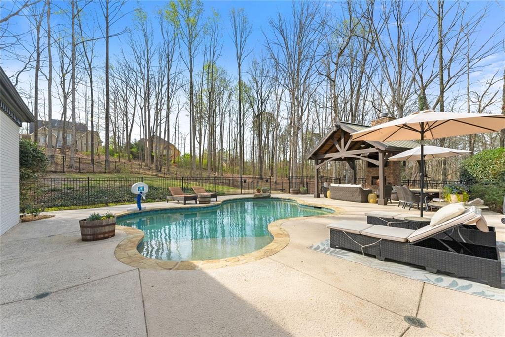 2195 East Maddox Road Buford, GA 30519 - Photo 68 of 100 a view of a swimming pool with lounge chairs in patio