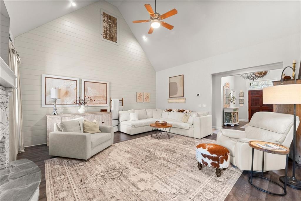 2195 East Maddox Road Buford, GA 30519 - Photo 9 of 100 a living room with furniture and a chandelier