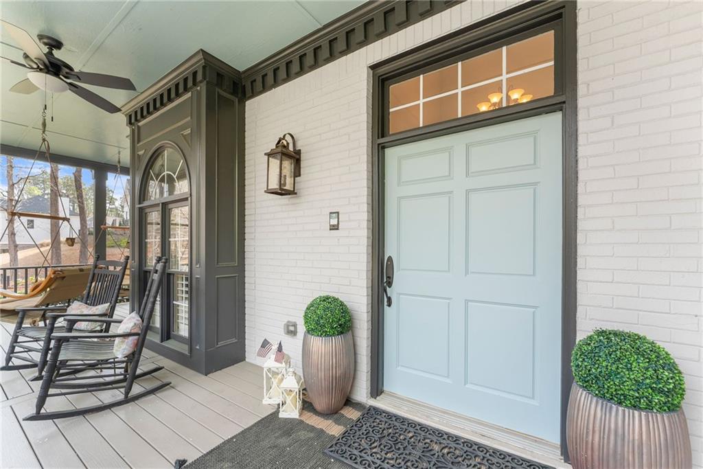 2195 East Maddox Road Buford, GA 30519 - Photo 97 of 100 a view of a house with a potted plant and floor to ceiling window