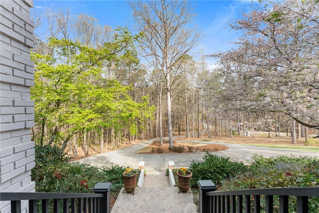 2195 East Maddox Road Buford, GA 30519 - Photo 99 of 100 a view of a yard with plants and trees