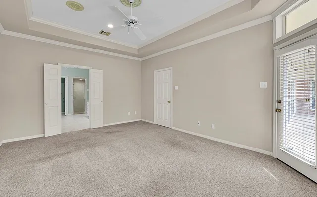 a spacious bathroom with a granite countertop tub sink and mirror