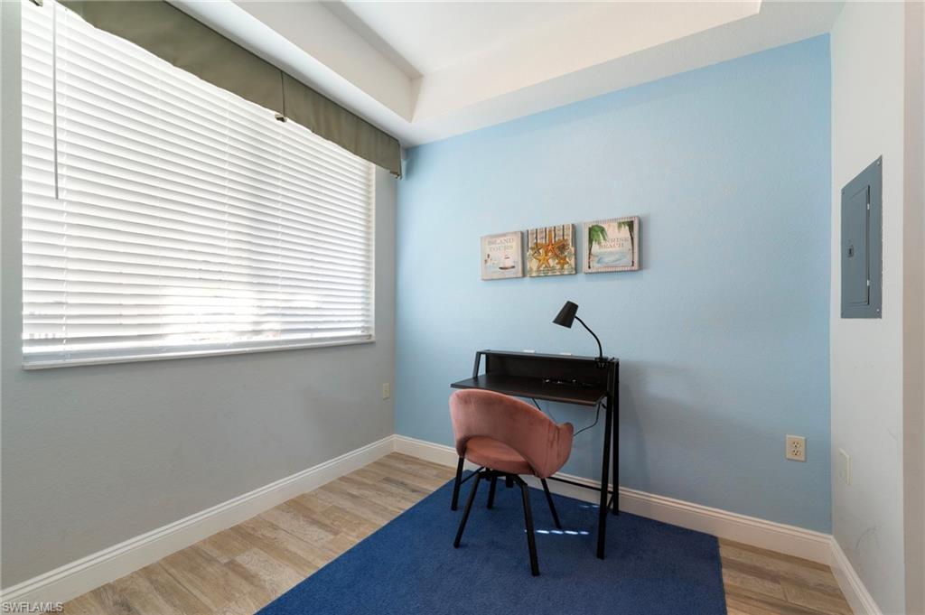 7940 Mahogany Run Lane, Unit 612 Naples, FL 34113 - Photo 11 of 25 a view of a workspace with furniture and a window