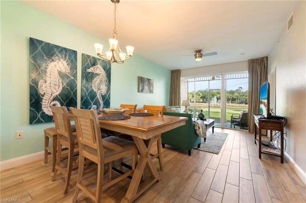 7940 Mahogany Run Lane, Unit 612 Naples, FL 34113 - Photo 21 of 25 a view of a dining room with furniture window and outside view