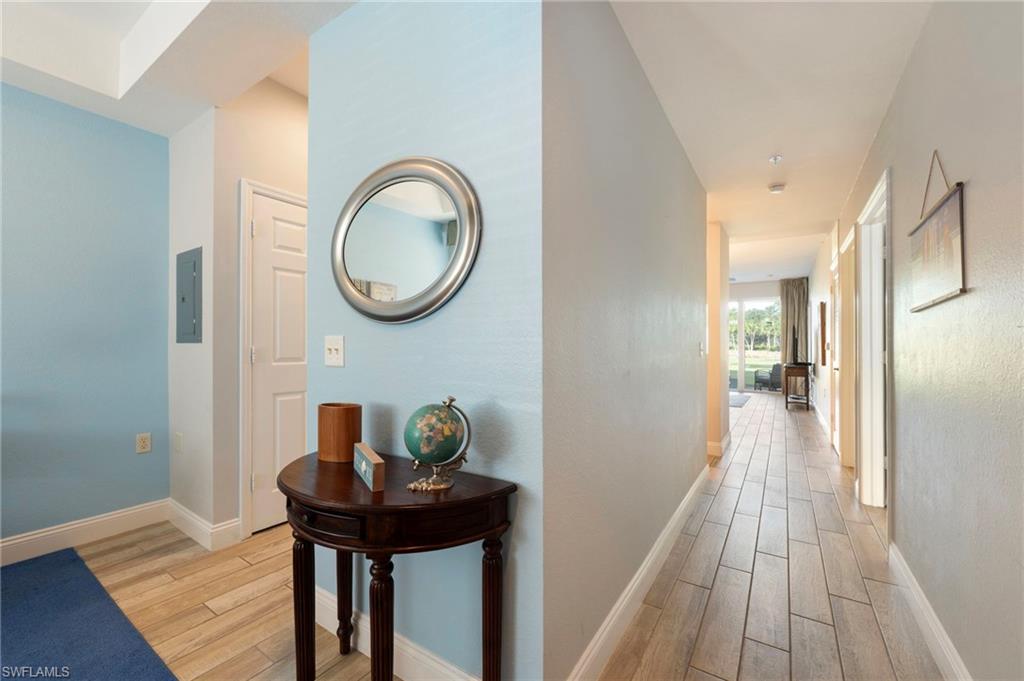 7940 Mahogany Run Lane, Unit 612 Naples, FL 34113 - Photo 22 of 25 a view of a hallway with seating area