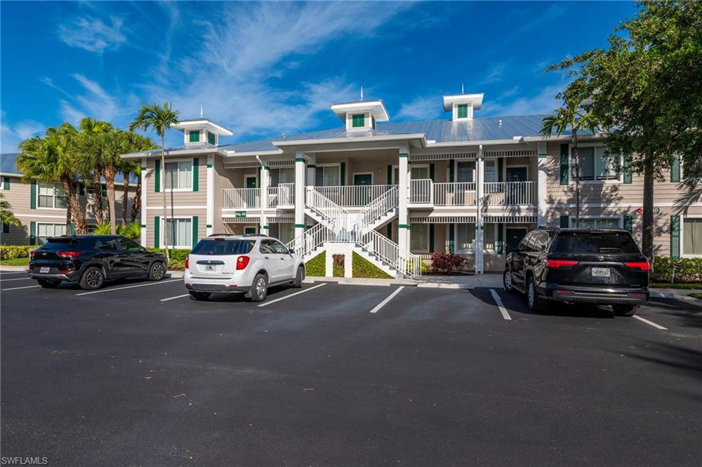 7940 Mahogany Run Lane, Unit 612 Naples, FL 34113 - Photo 24 of 25 a car parked in front of a house
