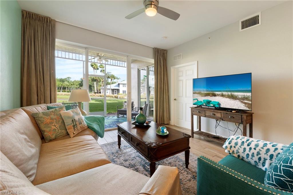 7940 Mahogany Run Lane, Unit 612 Naples, FL 34113 - Photo 25 of 25 a living room with furniture and a large window