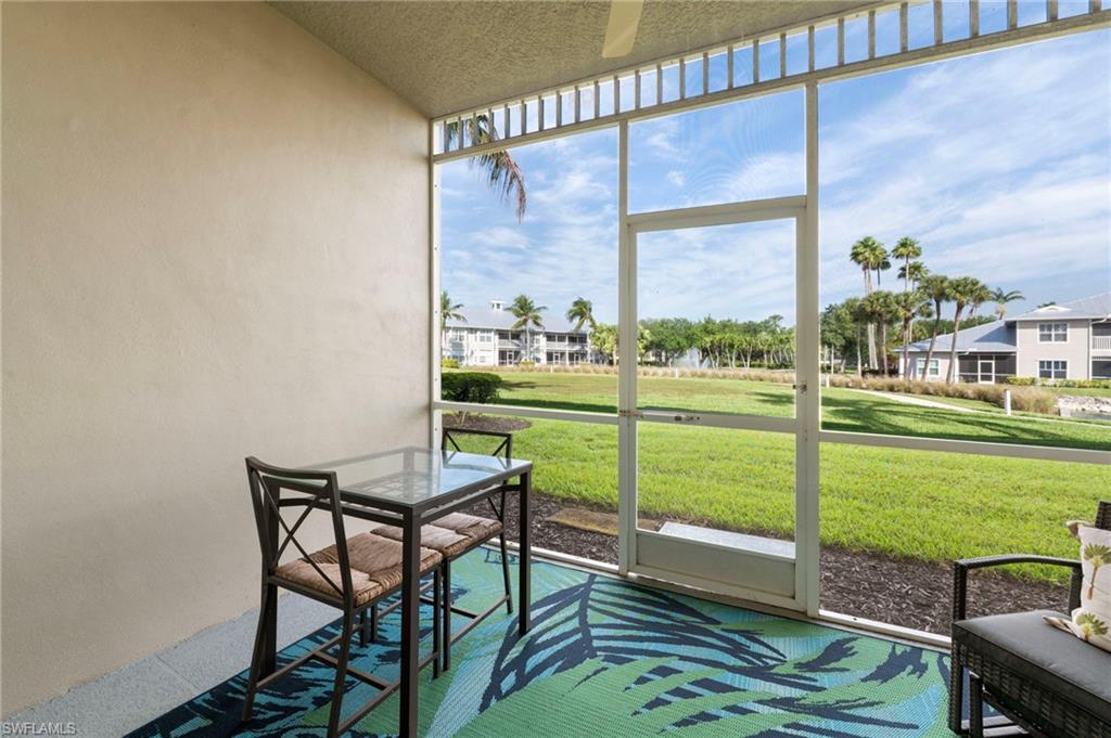 7940 Mahogany Run Lane, Unit 612 Naples, FL 34113 - Photo 3 of 25 a view of a balcony with lake view and a floor to ceiling window
