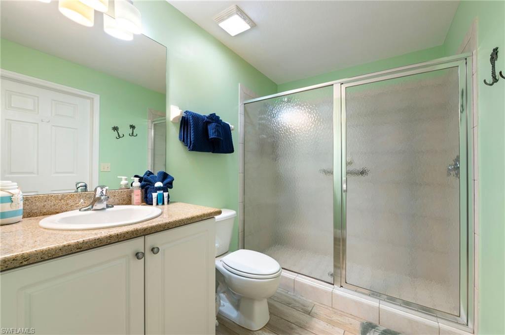 7940 Mahogany Run Lane, Unit 612 Naples, FL 34113 - Photo 4 of 25 a bathroom with a sink toilet and shower