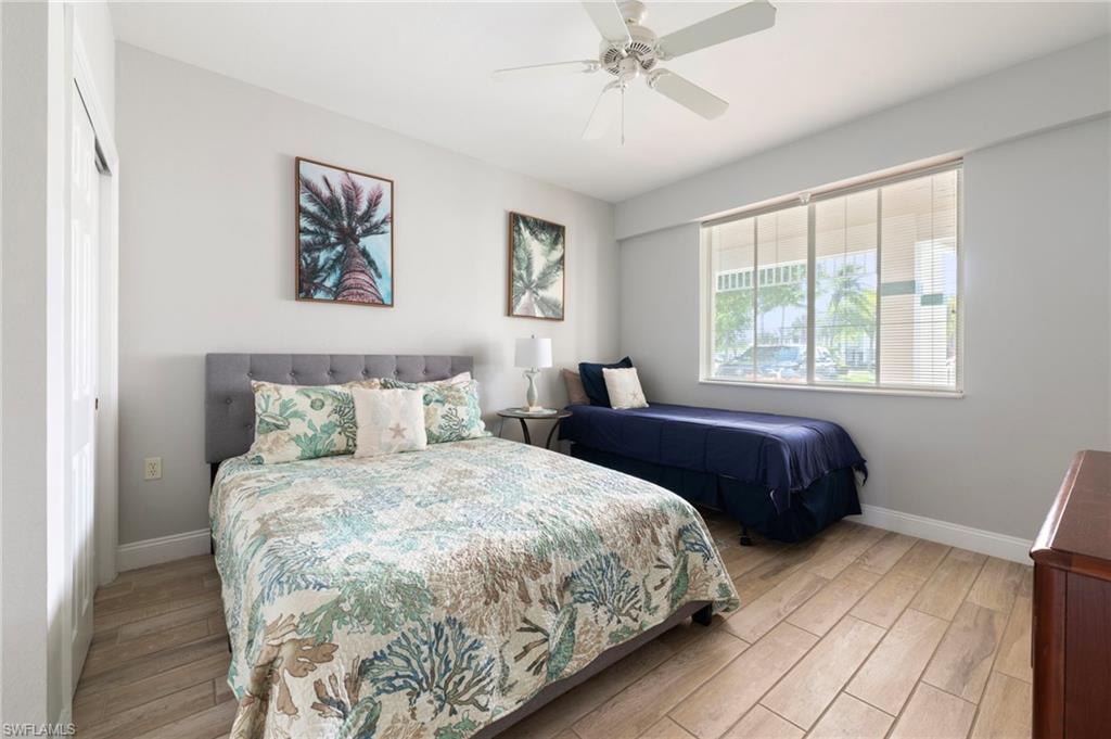 7940 Mahogany Run Lane, Unit 612 Naples, FL 34113 - Photo 6 of 25 a bedroom with a large bed and a window