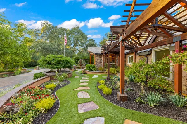 a kitchen with stainless steel appliances granite countertop a stove and a microwave