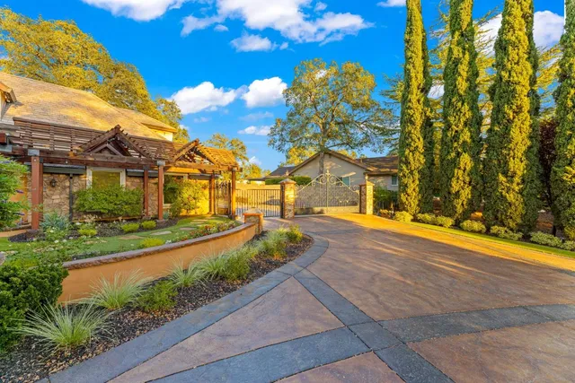 a kitchen with granite countertop cabinets stainless steel appliances a sink and window