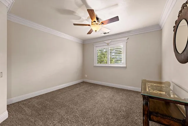 a view of a swimming pool with a patio and a fire pit