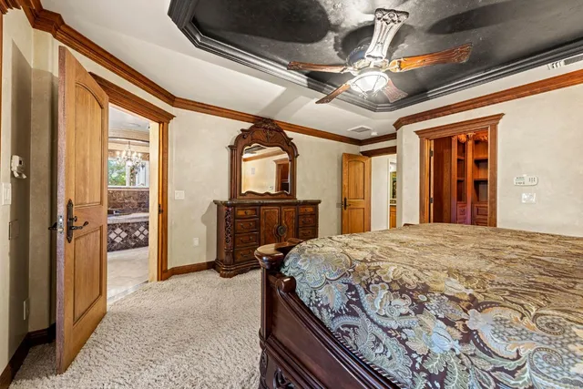 a living room with furniture a flat screen tv and a table