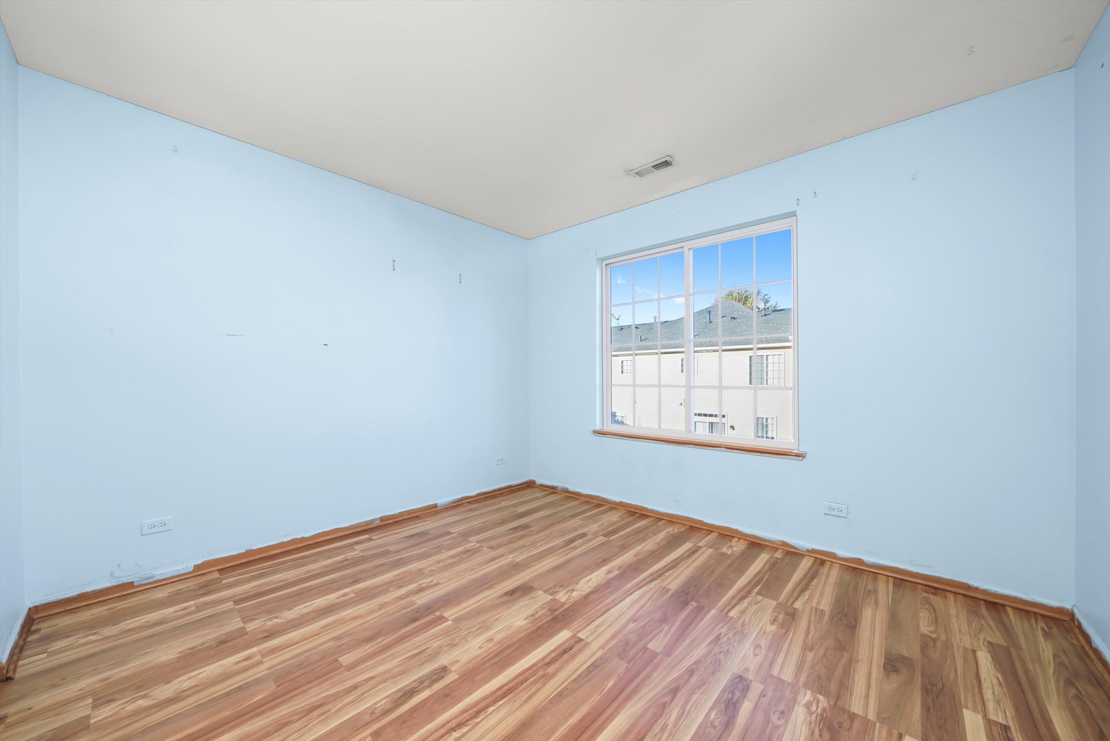 409 Evergreen Circle, Unit 4 Gilberts, IL 60136 - Photo 16 of 42 a view of empty room with wooden floor and fan