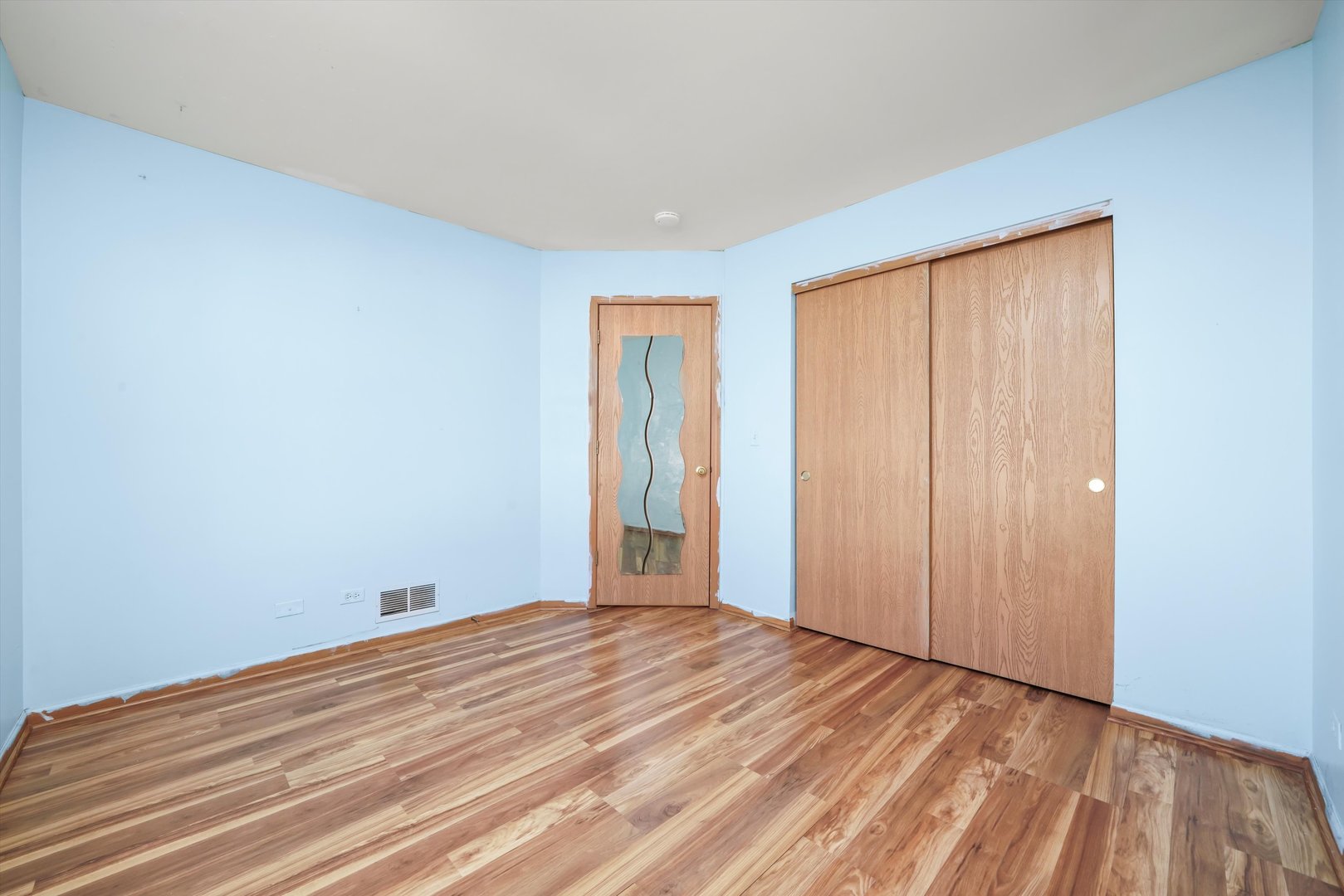409 Evergreen Circle, Unit 4 Gilberts, IL 60136 - Photo 18 of 42 a view of empty room with wooden floor