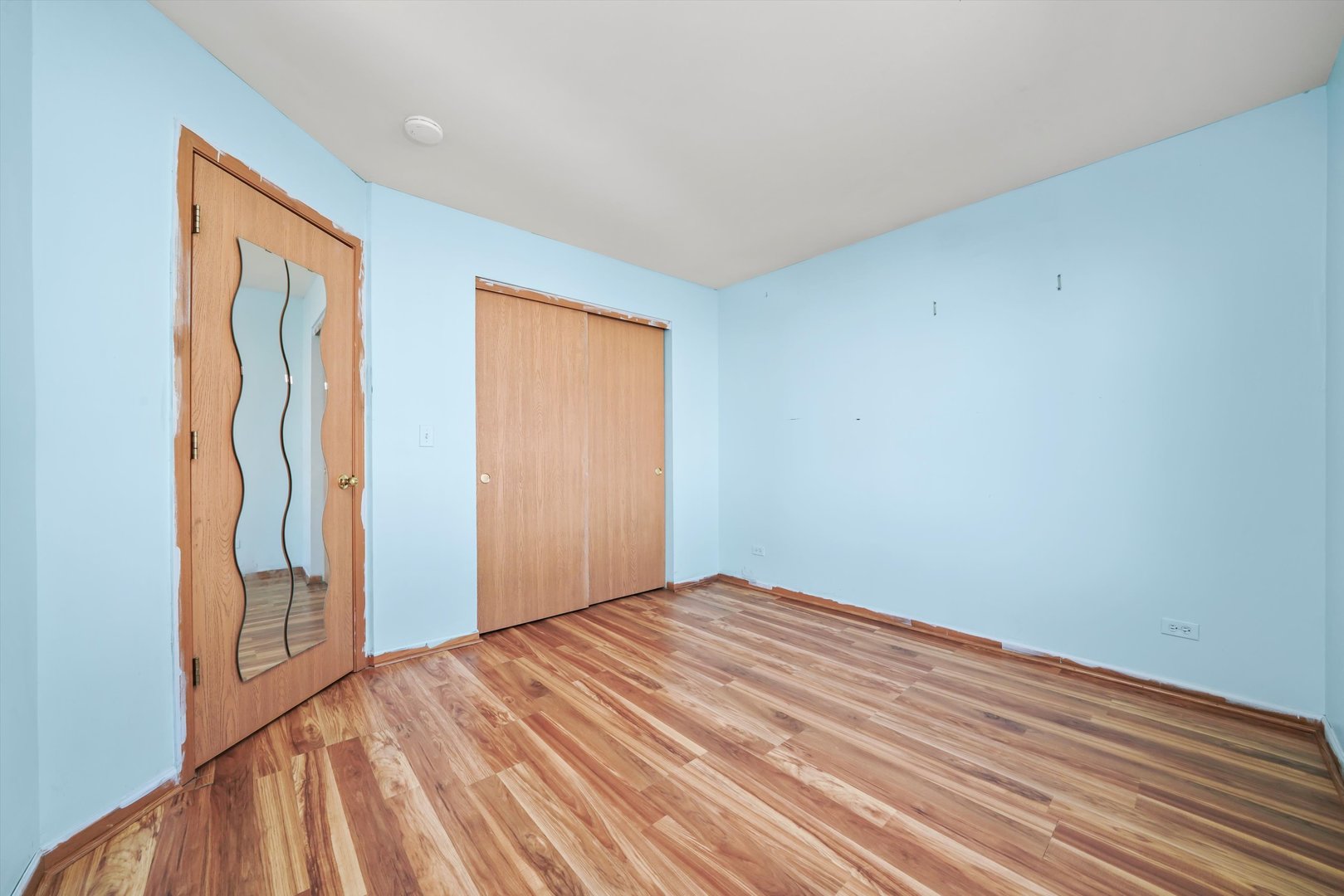 409 Evergreen Circle, Unit 4 Gilberts, IL 60136 - Photo 19 of 42 a view of empty room with wooden floor and fan