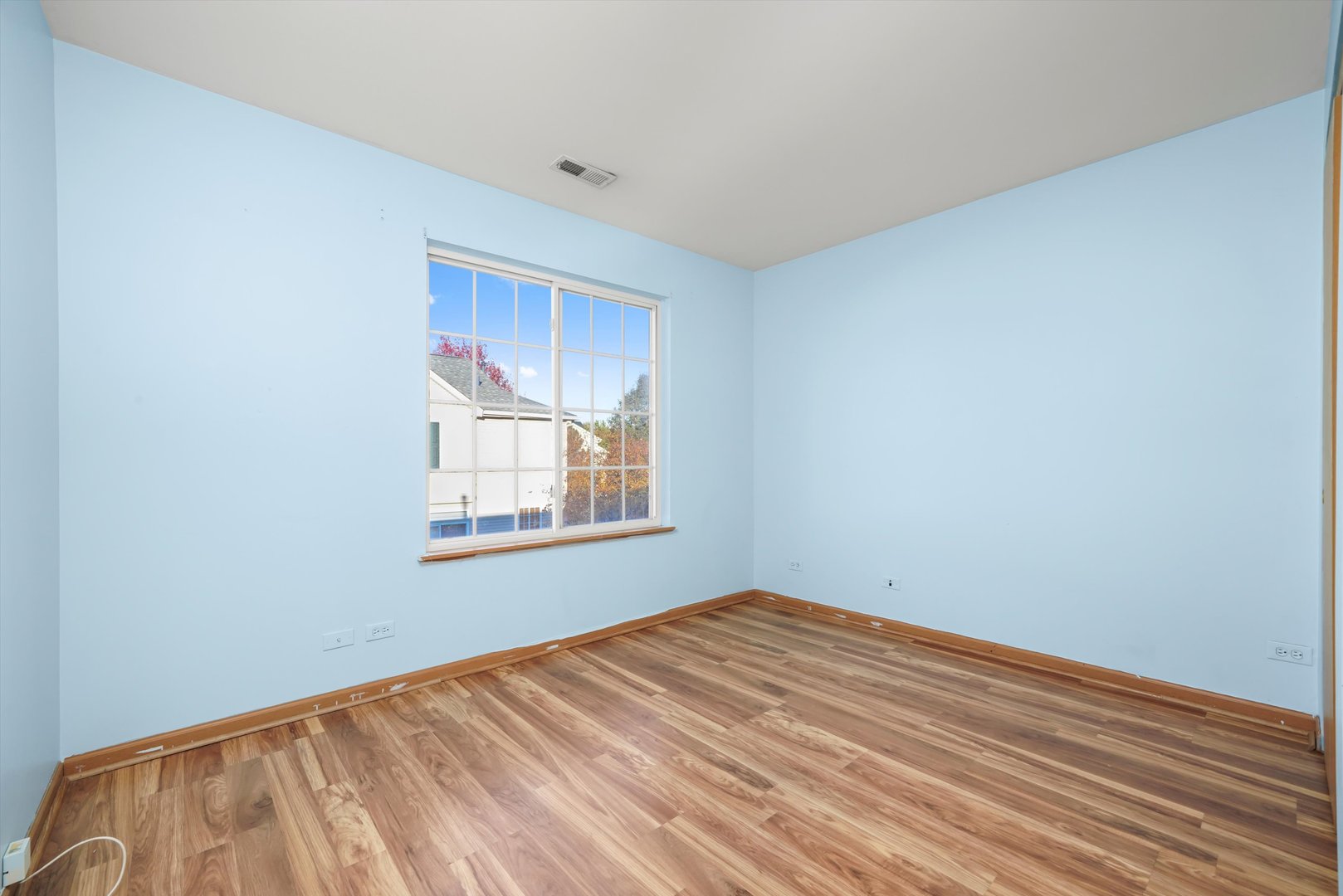 409 Evergreen Circle, Unit 4 Gilberts, IL 60136 - Photo 20 of 42 a view of empty room with wooden floor