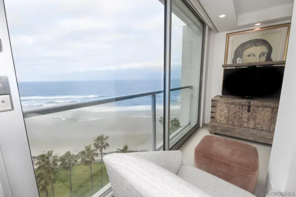 a bedroom with a bed and a lamp