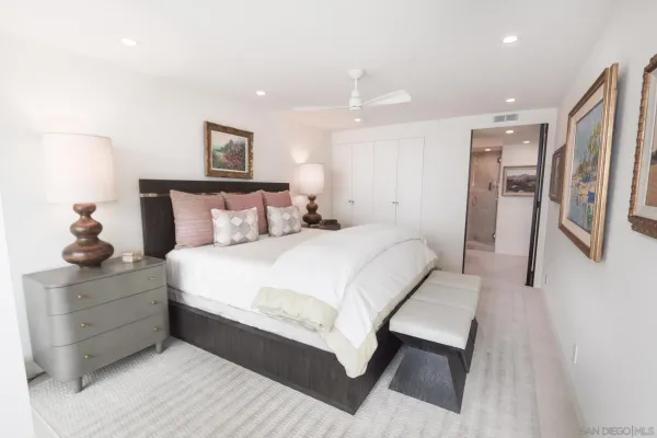 a bedroom with bed and window