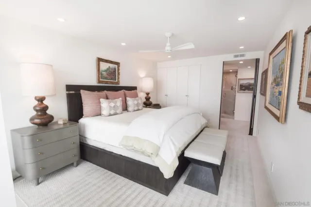 a bedroom with bed and window