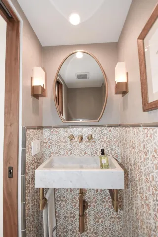a spacious bathroom with a double vanity sink mirror and shower