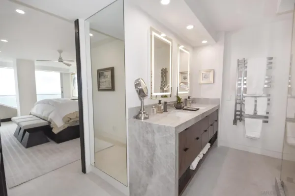 a living room with a large window and a floor to ceiling window