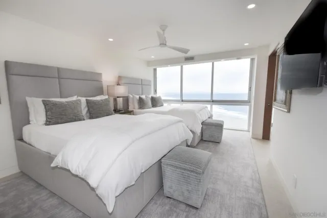 a bathroom with a double vanity sink toilet and shower