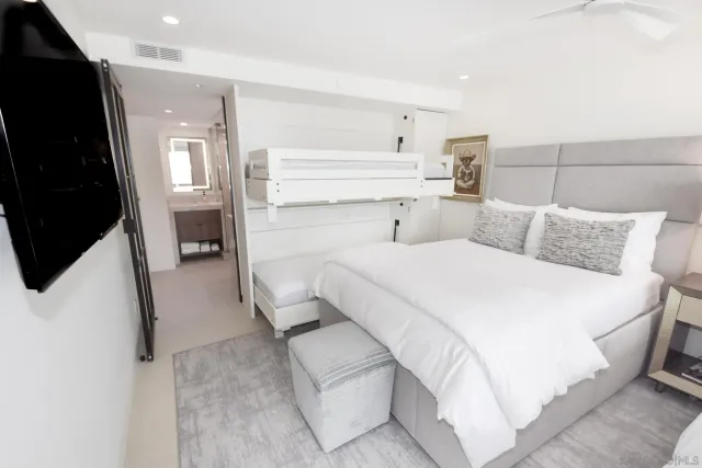 a bathroom with double vanity sinks and a mirror