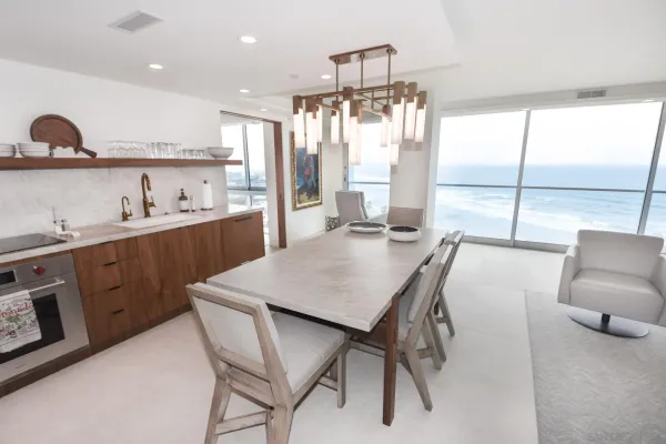 a kitchen with a sink a stove and cabinets