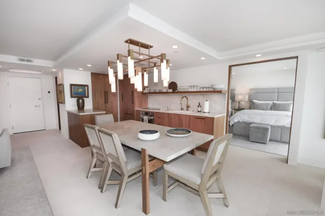 a kitchen with kitchen island cabinets and appliances